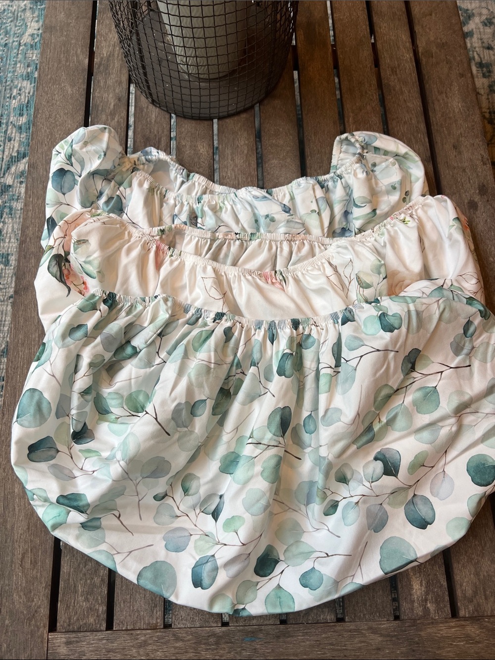 3 Bassinet floral sheets and 4 changing pads